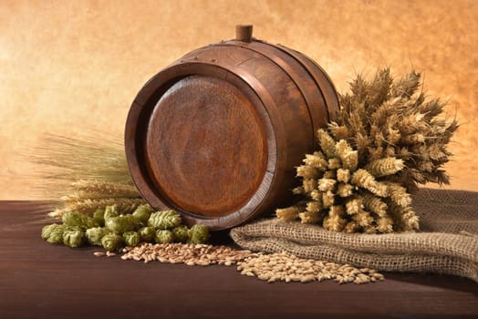 Old barrel with wheat,barley,hops and malt