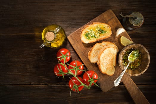 Appetizer Bruschetta with sauce of olive oil, garlic and herbs.