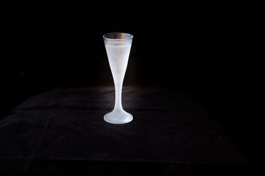 a cold shot in a black background ready to drink