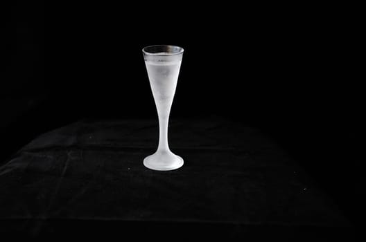 a cold shot in a black background ready to drink