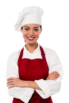 Smiling female chef isolated on white