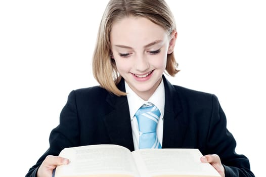 Teenage entrepreneur reading a book