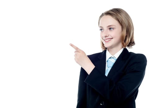 Girl in business attire pointing away