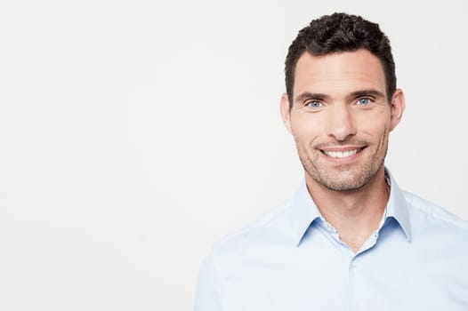 Handsome man posing with a warm smile