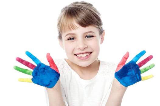 Cheerful kid showing her painted palms