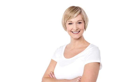 Happy middle aged woman with her arms crossed