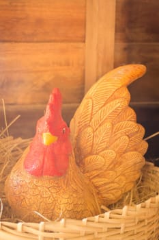 Porcelain chicken doll in the nest, stock photo