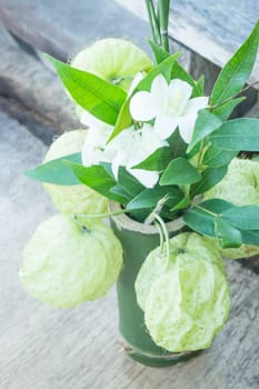 White flower decorated on wooden table, stock photo