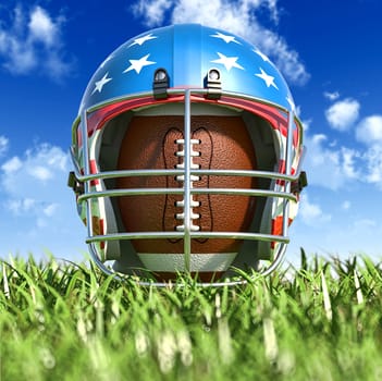 American football helmet over the oval ball, on the grass. Frontal Close up view, from the ground level. With sky and fluffy clouds on background. Foreground grass out of focus. (dof effect).