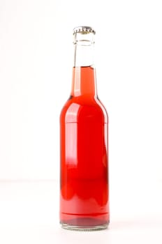 Bottle of elder juice on a white background