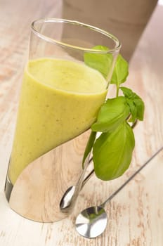 Green smoothie on a wooden table