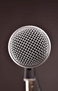 Modern microphone in a studio, close up with focus on foreground
