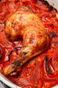 Spicy Italian chicken in a white bowl with tomatoes , red pepper and hot chili