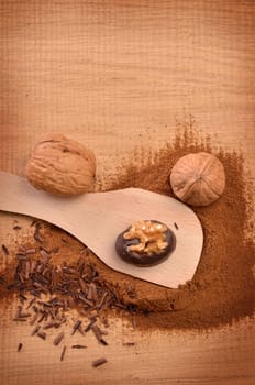 Chocolate with walnuts on a rustic wooden table