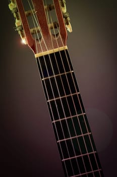 Detail of an old acoustic guitar with dust and scratches