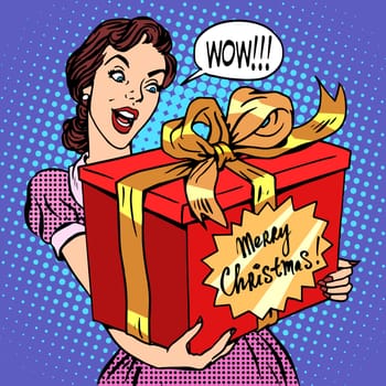 Woman with Christmas gift pop art retro style. Beautiful girl with a big red box with the words merry Christmas. Celebrations and congratulations. Family and joy