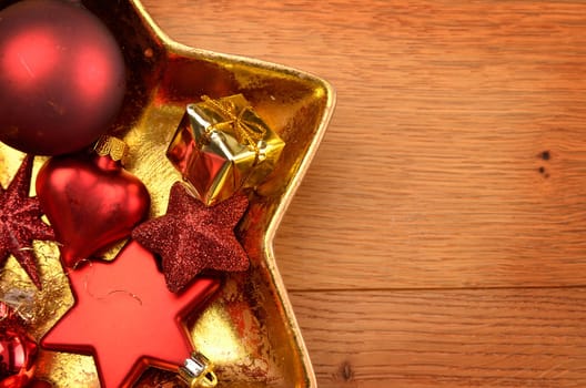 Christmas decoration in a star shaped bowl on a wooden table