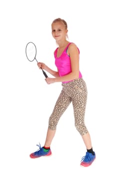 A beautiful little girl holding her tennis racquet in her hand in a pink.bathing suit and tights, isolated for white background..
