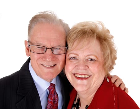 A nice senior couple standing isolated for white background, in a closeup.image head on head and smiling..