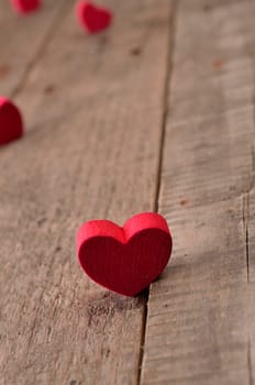 Red heart shape on a rustic wooden background