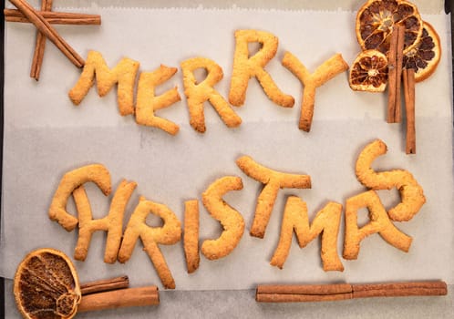 Sweet Christmas cookies with dried fruit slices and cinnamon