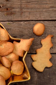 Sweet Christmas cookies on a rustic wooden background