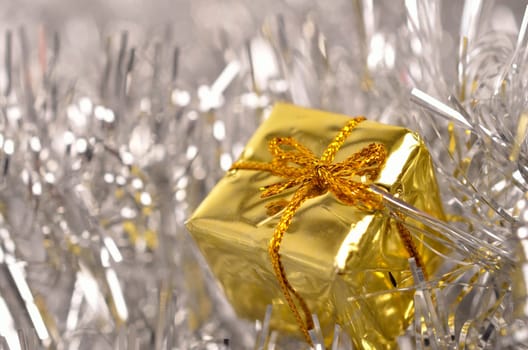 Golden gift box with luxury Christmas decoration in silver