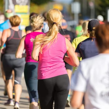 Group of active people running in the city. Healthy lifestyle. Weight Loss. Urban marathon run.