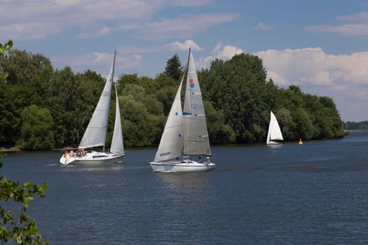 Two sailboats meet on the Havel in Berlin