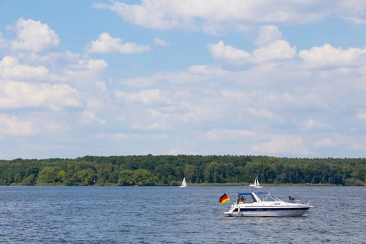 Small motorboat with a large flag
