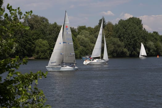 Two sailboats pass each other