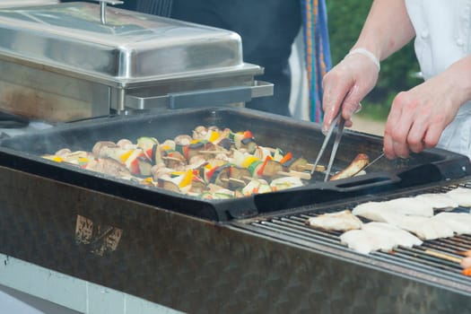 Meat skewers and veal on a charcoal grill