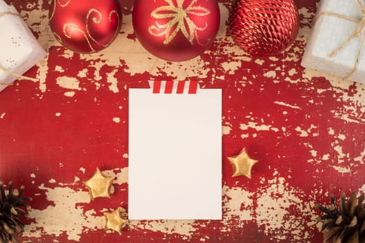 Merry Christmas Happy New Year top view concept greeting card mockup with retro holiday decoration on grunge wood texture background. Includes clipping path.