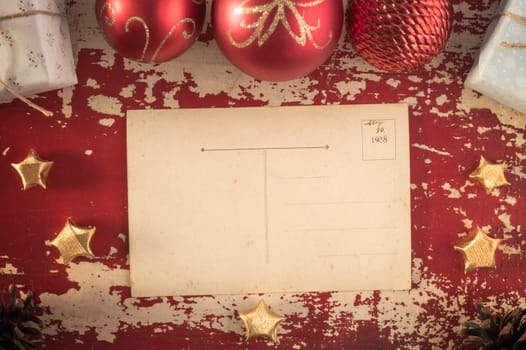 Merry Christmas top view vintage postcard on retro grunge wood background with xmas ornament decoration. Includes clipping path for card.