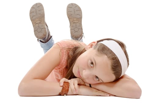 a portrait of smiling little girl lying on the floor isolated on white background