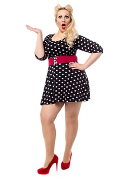 Full length image of a surprised woman against white