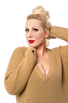 stylish woman in knitwear posing over white