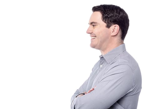 Handsome smart man posing sideways over white