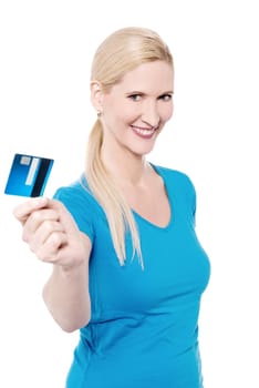 Woman lending her plastic card to you against white