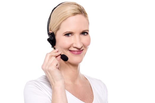 Female executive posing to camera with headset