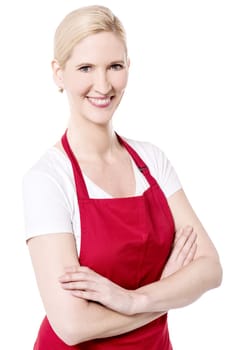 Happy woman chef posing with arms crossed to camera