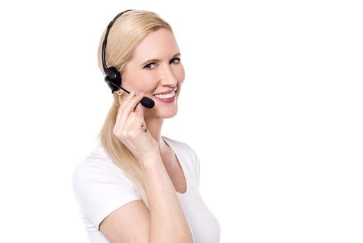 Happy customer support executive talking to her customer