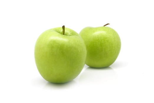 Two green apples on white background