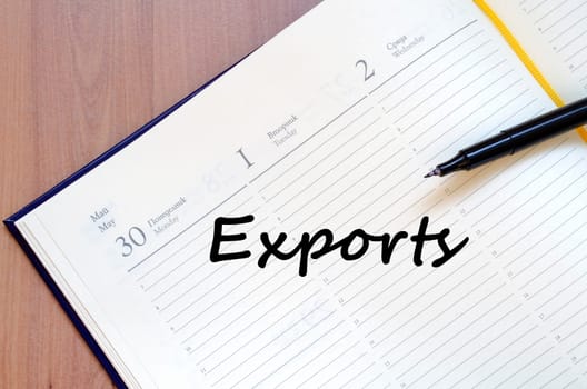 Exports text concept write on notebook with pen