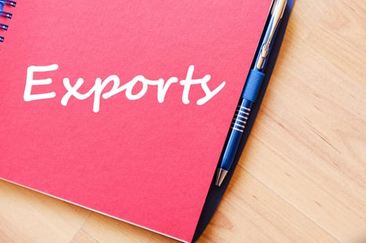 Exports text concept write on notebook with pen