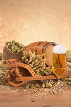 Beer glass with barrel,wheelbarrow,wheat,barley,hops and malt