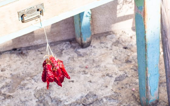 Many chilli hanging wooden table . .