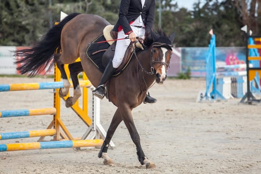 Detailed view of a boot rider with spurs at jumping competition