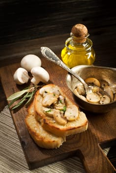 Appetizer Bruschetta with sauce of olive oil, mushrooms and herbs.