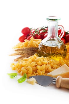 Raw Pasta with ingredients on white background.